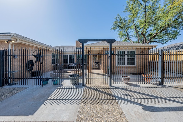view of gate with fence