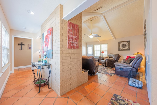 hall featuring brick wall, light tile patterned floors, lofted ceiling with beams, and visible vents