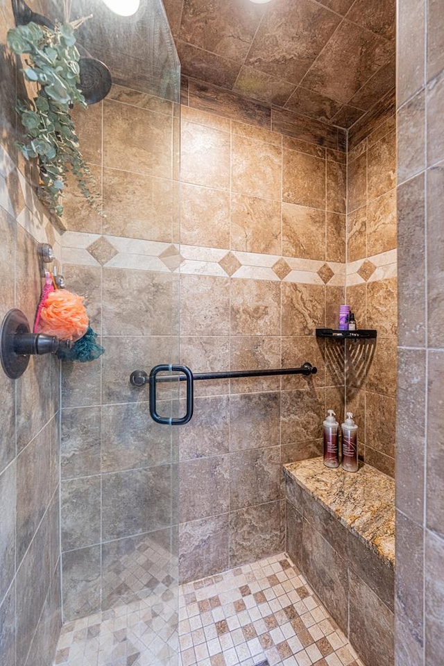 bathroom featuring a shower stall