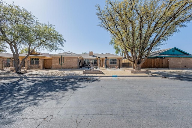 single story home with fence