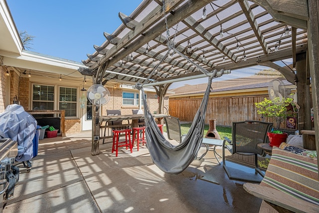 view of patio / terrace featuring grilling area, outdoor dining space, a pergola, and fence