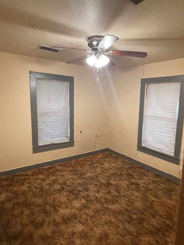 carpeted empty room with ceiling fan