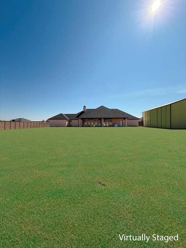 view of yard with fence