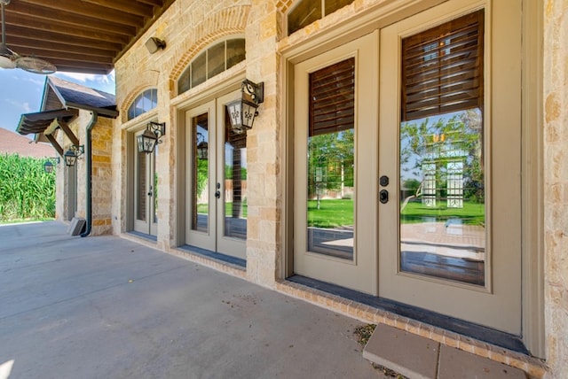 view of exterior entry featuring french doors