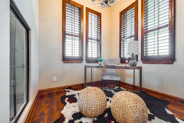 office with an inviting chandelier and wood-type flooring