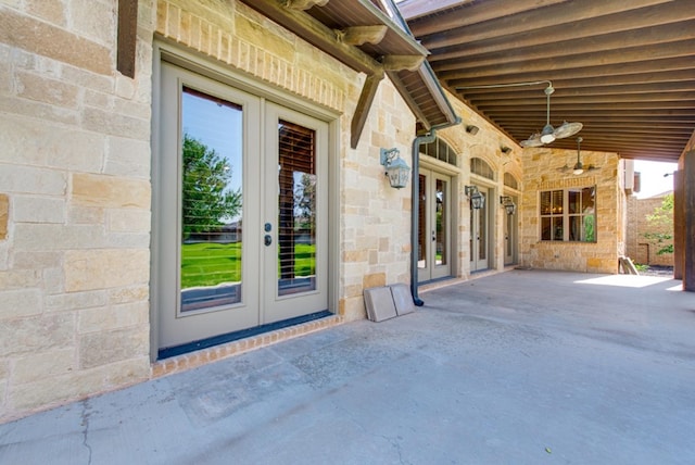 property entrance featuring a patio, ceiling fan, and french doors