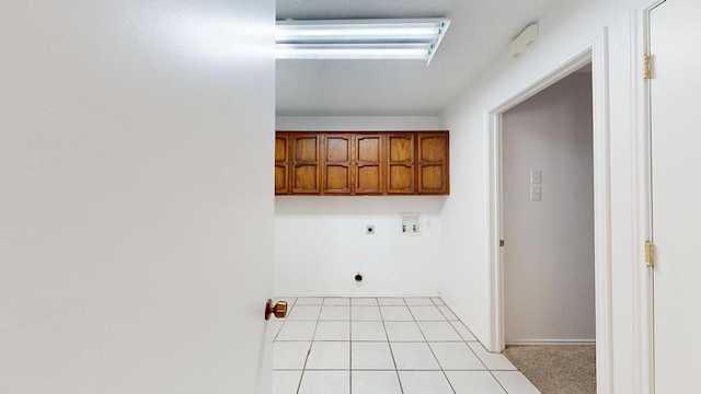4203 Skyline Dr, Midland, TX 79707 - washroom with cabinet space, electric dryer hookup, hookup for a washing machine, light tile patterned flooring, and baseboards