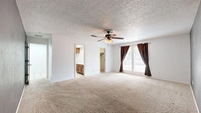 4203 Skyline Dr, Midland, TX 79707 - unfurnished room featuring ceiling fan, light carpet, and a textured ceiling