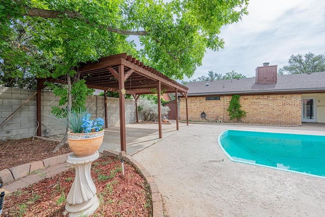 4203 Skyline Dr, Midland, TX 79707 - view of swimming pool with a patio area, a fenced backyard, and a pergola