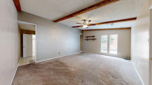 4203 Skyline Dr, Midland, TX 79707 - carpeted empty room with a textured ceiling, a ceiling fan, and beamed ceiling