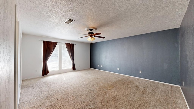 4203 Skyline Dr, Midland, TX 79707 - carpeted empty room with ceiling fan, baseboards, and a textured ceiling