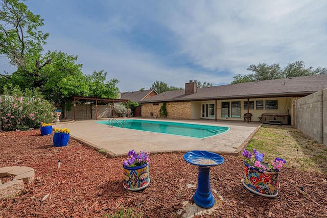 4203 Skyline Dr, Midland, TX 79707 - view of swimming pool featuring a patio and a fenced backyard