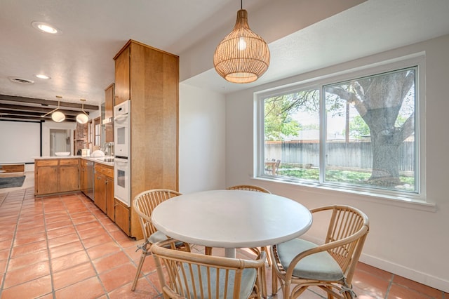 dining space with light tile patterned flooring, baseboards, and recessed lighting