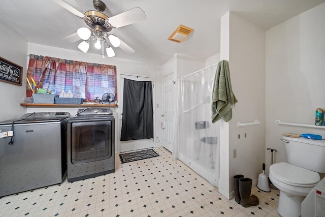 laundry area with ceiling fan and washing machine and dryer