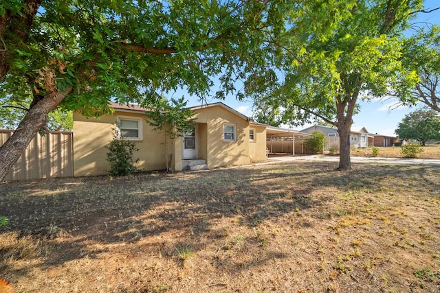 exterior space with a carport