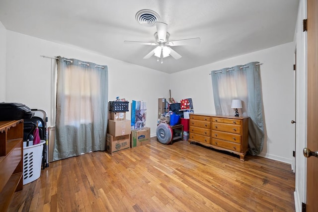 bedroom with hardwood / wood-style flooring and ceiling fan