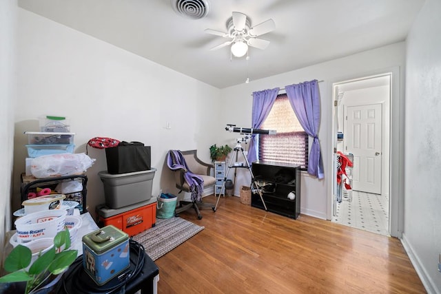 interior space with hardwood / wood-style flooring and ceiling fan