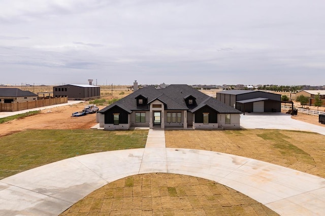 6407 W County Rd 41, Midland, TX 79707 - modern inspired farmhouse featuring curved driveway, a chimney, and roof with shingles