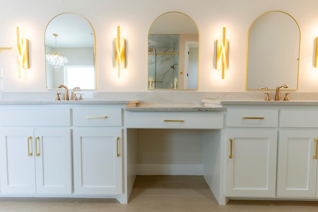 6407 W County Rd 41, Midland, TX 79707 - bathroom featuring a marble finish shower, double vanity, and a chandelier