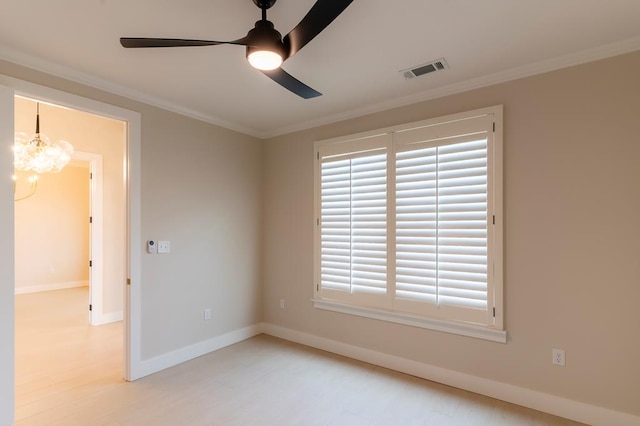 6407 W County Rd 41, Midland, TX 79707 - empty room with ornamental molding, a ceiling fan, a chandelier, baseboards, and wood finished floors