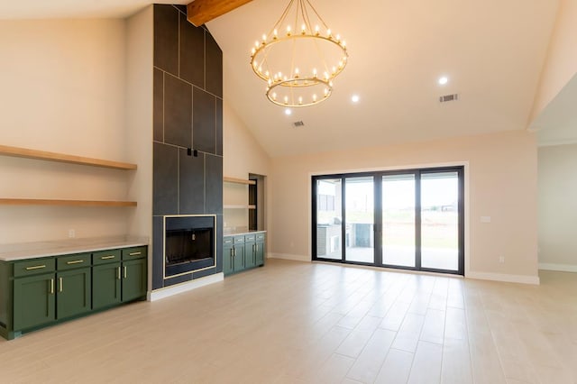 6407 W County Rd 41, Midland, TX 79707 - unfurnished living room featuring high vaulted ceiling, a chandelier, baseboards, a fireplace, and light wood finished floors