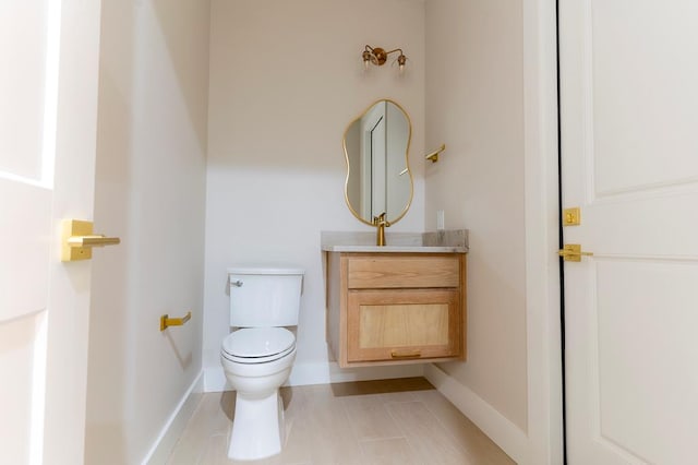 6407 W County Rd 41, Midland, TX 79707 - half bathroom featuring toilet, vanity, and baseboards