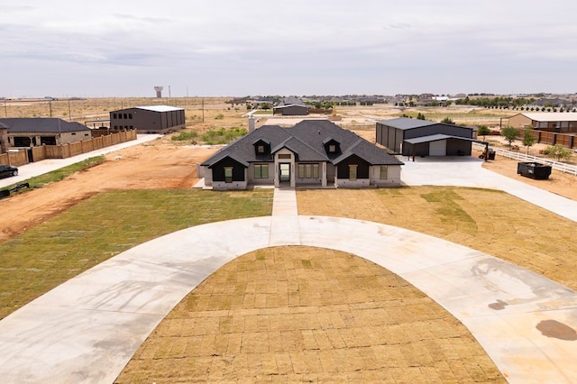 6407 W County Rd 41, Midland, TX 79707 - view of front of house featuring curved driveway and a garage