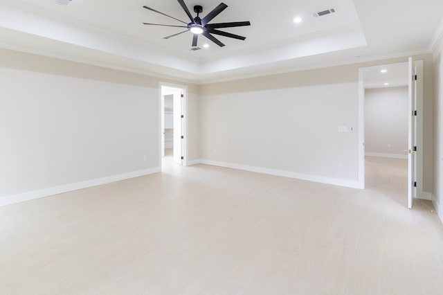 6407 W County Rd 41, Midland, TX 79707 - empty room with a raised ceiling, ceiling fan, recessed lighting, light wood-style flooring, and ornamental molding