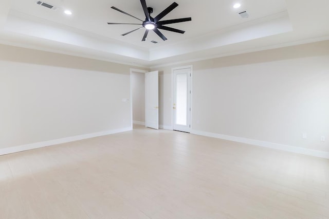 6407 W County Rd 41, Midland, TX 79707 - spare room with a raised ceiling, a ceiling fan, light wood-style flooring, baseboards, and recessed lighting