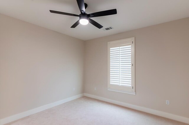 6407 W County Rd 41, Midland, TX 79707 - empty room with light carpet, a ceiling fan, and baseboards