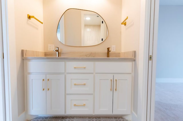 6407 W County Rd 41, Midland, TX 79707 - bathroom with double vanity and baseboards