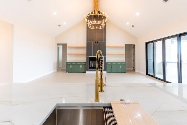 6407 W County Rd 41, Midland, TX 79707 - detailed view of green cabinetry, open shelves, a chandelier, and baseboards