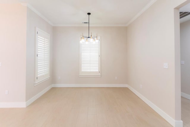 6407 W County Rd 41, Midland, TX 79707 - empty room featuring a chandelier, light wood-style floors, crown molding, and baseboards