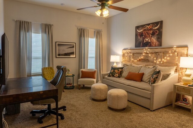 carpeted office featuring ceiling fan