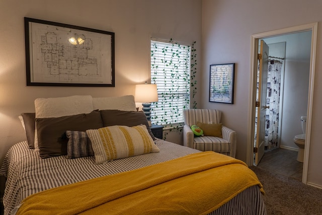 carpeted bedroom featuring ensuite bathroom