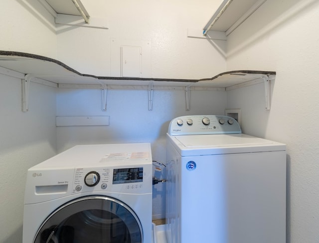 washroom with washer and dryer