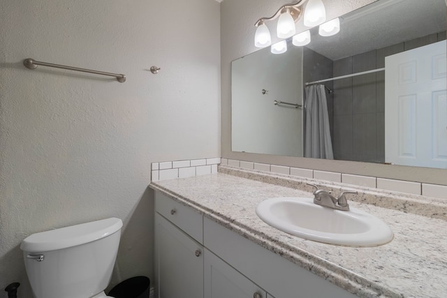 bathroom with tasteful backsplash, curtained shower, vanity, and toilet