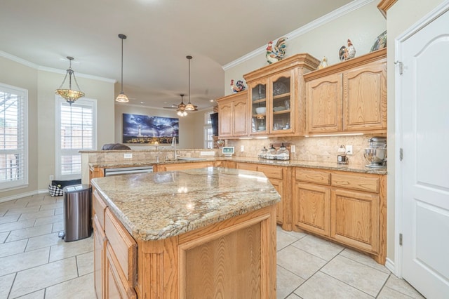 1900 Fringewood Dr, Midland, TX 79707 - kitchen featuring light tile patterned floors, a peninsula, decorative backsplash, and a center island