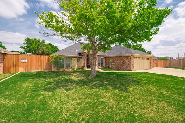 1900 Fringewood Dr, Midland, TX 79707 - ranch-style house with a front lawn, driveway, brick siding, an attached garage, and fence