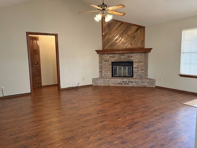 unfurnished living room featuring baseboards, a fireplace, wood finished floors, high vaulted ceiling, and a ceiling fan