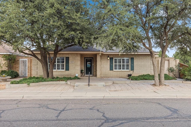 3502 Wedgewood St, Midland, TX 79707 - view of front of home featuring brick siding