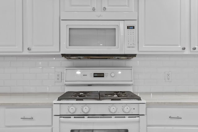 3502 Wedgewood St, Midland, TX 79707 - kitchen with white appliances, decorative backsplash, and white cabinetry