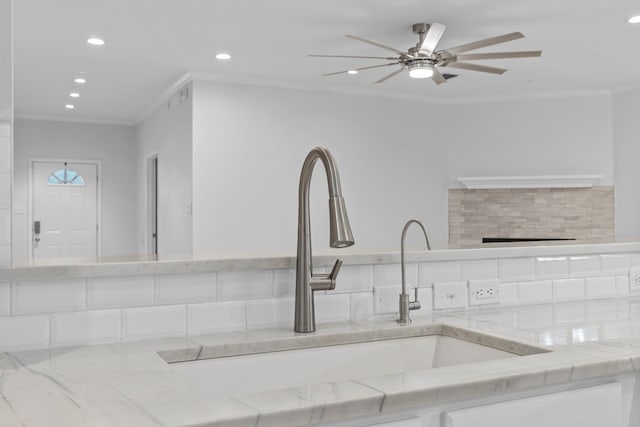 3502 Wedgewood St, Midland, TX 79707 - kitchen featuring recessed lighting, ornamental molding, ceiling fan, and light stone countertops
