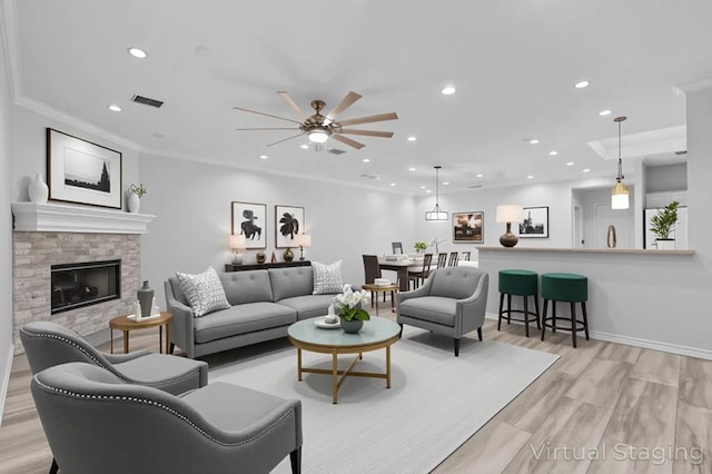 3502 Wedgewood St, Midland, TX 79707 - living area featuring ceiling fan, a fireplace, recessed lighting, light wood-style floors, and crown molding