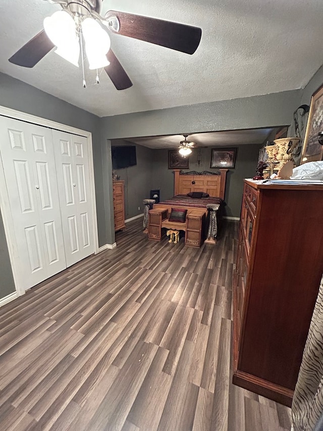1202 N Gillis Ft, Stockton, TX 79735 - game room featuring dark wood-style floors, a textured ceiling, and a ceiling fan