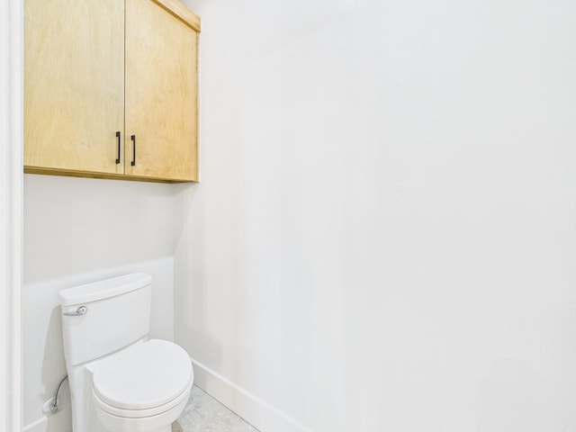 1905 Beaty Rd, San Angelo, TX 76904 - bathroom featuring baseboards and toilet