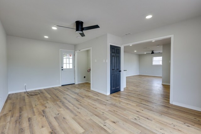 unfurnished room featuring a ceiling fan, plenty of natural light, recessed lighting, light wood-style floors, and baseboards