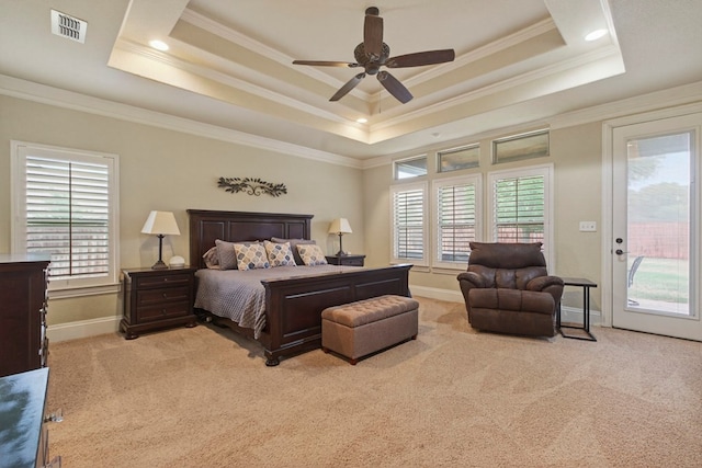 6407 Saddle Horn Ln, Midland, TX 79707 - carpeted bedroom with a raised ceiling, access to exterior, multiple windows, ornamental molding, and baseboards