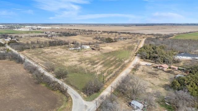 birds eye view of property featuring a rural view