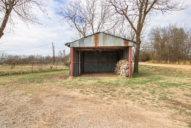 view of outdoor structure with a lawn